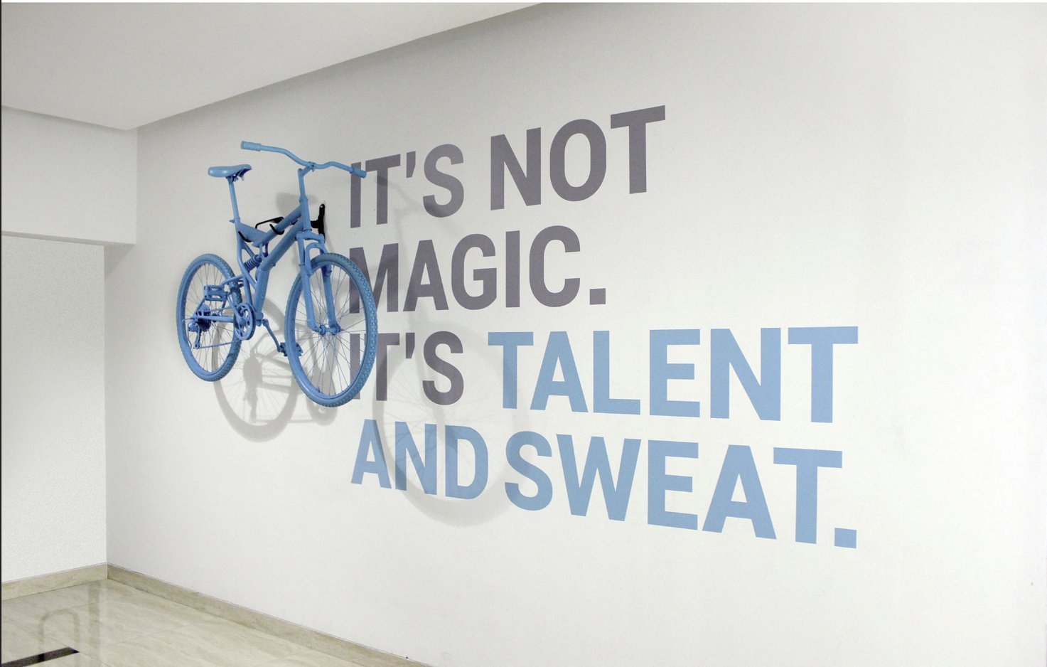 Talentica Pune — paper airplane vinyl wall, UV-print glass film